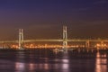 Panorama of Yokohama Bay Bridge from ÃÅsanbashi Pier in the Minato Mirai district of Yokohama with boats under the night sky. Royalty Free Stock Photo